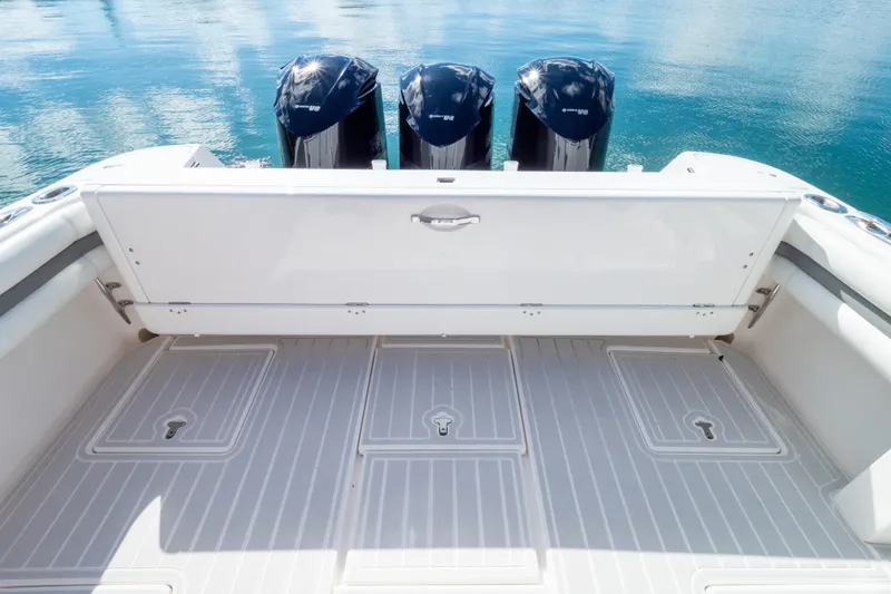  Yacht Photos Pics 2015 Intrepid 400 Center Console boat with triple outboard engines on calm water.
