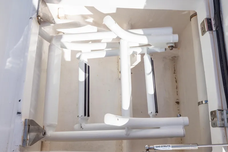  Yacht Photos Pics Storage compartment of a 2015 Intrepid 400 Center Console boat with gas struts.
