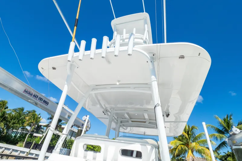  Yacht Photos Pics 2015 Intrepid 400 Center Console boat with T-top against clear blue sky.