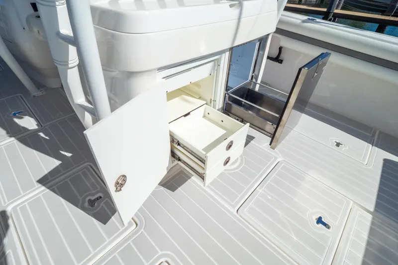  Yacht Photos Pics 2015 Intrepid 400 Center Console boat storage compartments open on deck.