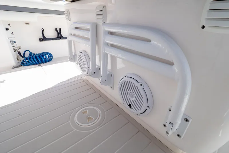  Yacht Photos Pics 2015 Intrepid 400 Center Console interior with speakers and coiled hose.