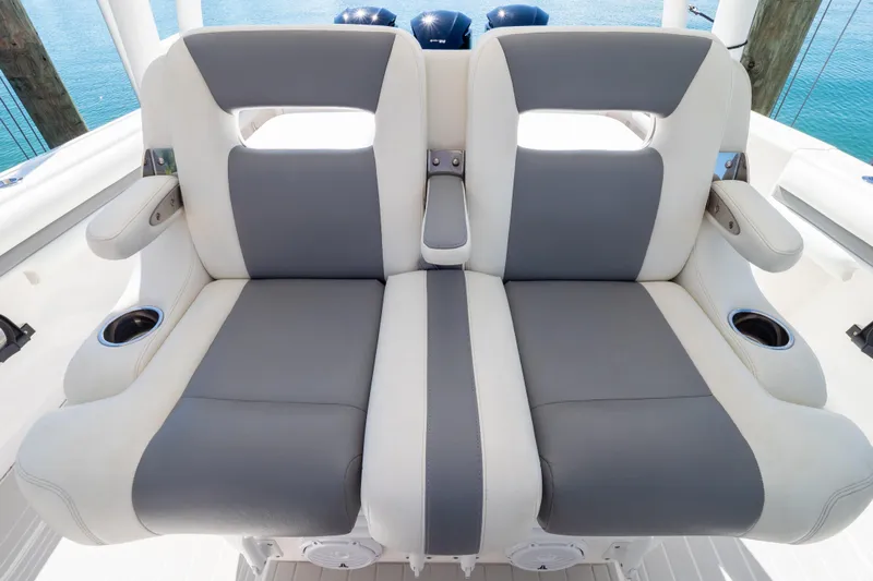  Yacht Photos Pics 2015 Intrepid 400 Center Console boat seats with cup holders, featuring gray and white upholstery.