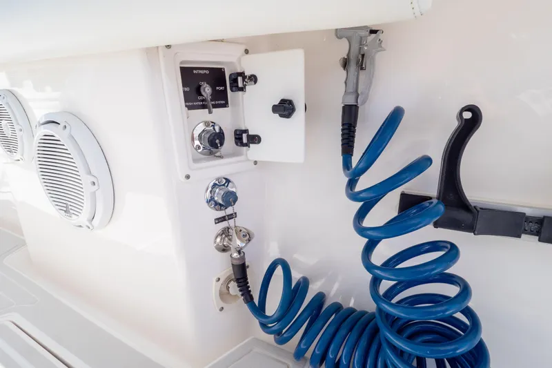  Yacht Photos Pics Control panel and coiled hose on 2015 Intrepid 400 Center Console boat.