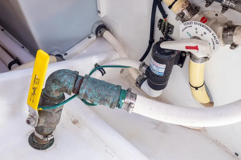  Yacht Photos Pics Plumbing system of 2015 Intrepid 400 Center Console boat with valves and hoses.