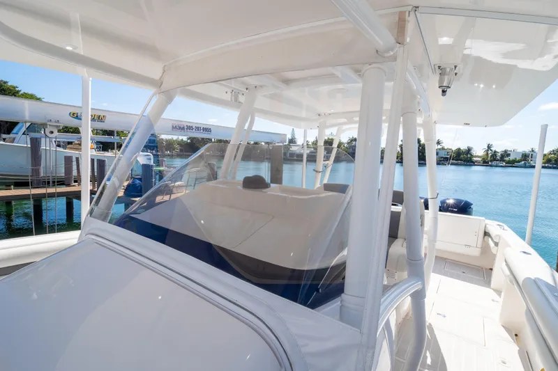  Yacht Photos Pics 2015 Intrepid 400 Center Console boat docked by the water.