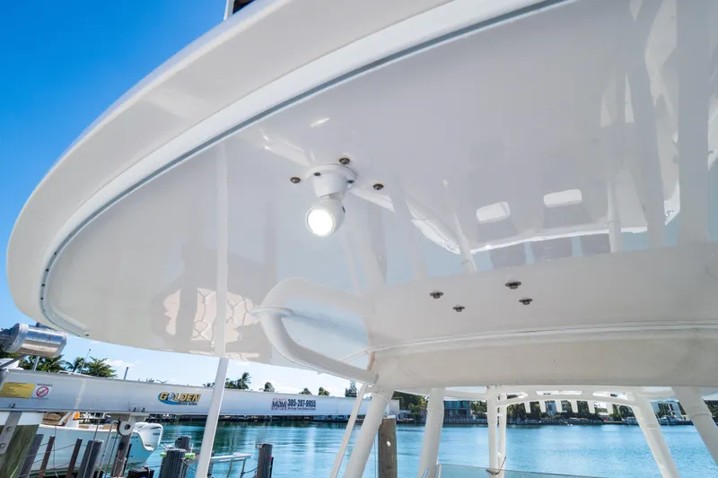  Yacht Photos Pics 2015 Intrepid 400 Center Console boat with sleek white canopy and lighting.