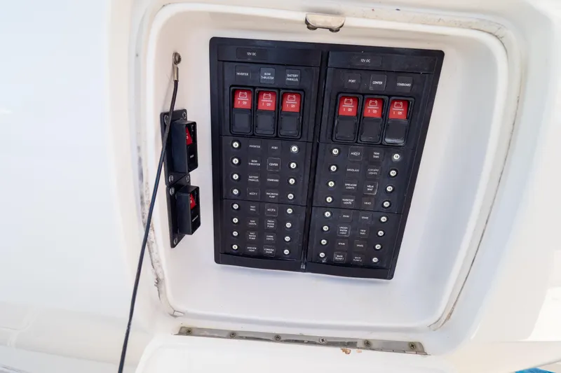  Yacht Photos Pics Electrical panel on a 2015 Intrepid 400 Center Console boat, featuring switches and circuit breakers.