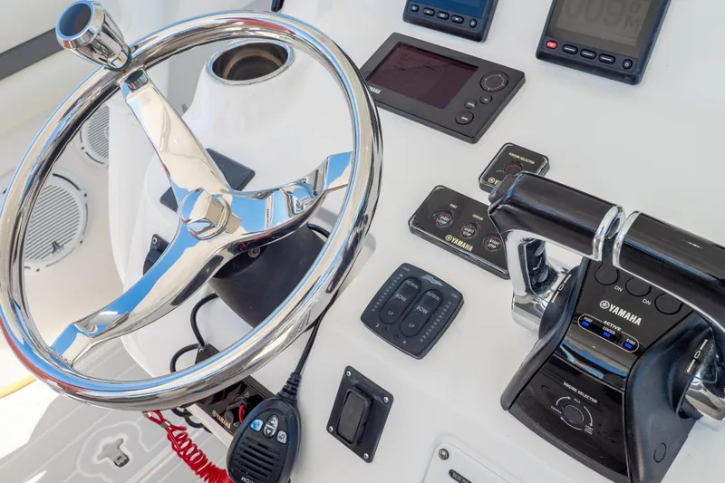 Yacht Photos Pics Control panel of 2015 Intrepid 400 Center Console with Yamaha throttle and steering wheel.