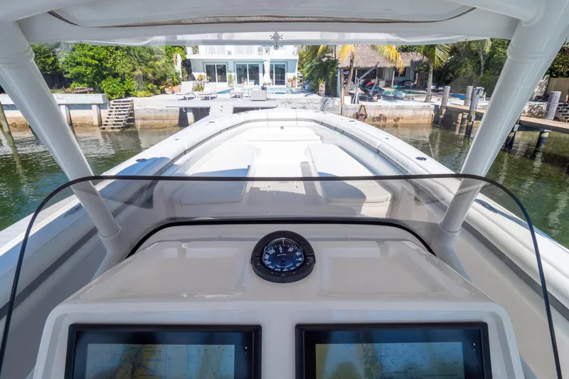  Yacht Photos Pics 2015 Intrepid 400 Center Console boat at dock, featuring navigation equipment.