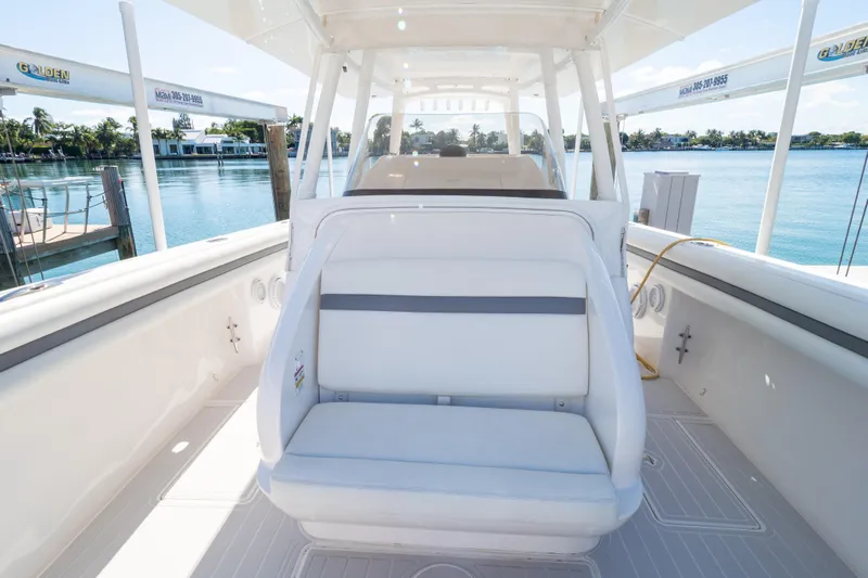  Yacht Photos Pics 2015 Intrepid 400 Center Console boat interior with seating, docked by calm waters.