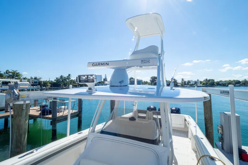  Yacht Photos Pics 2015 Intrepid 400 Center Console boat docked with Garmin equipment under clear blue sky.