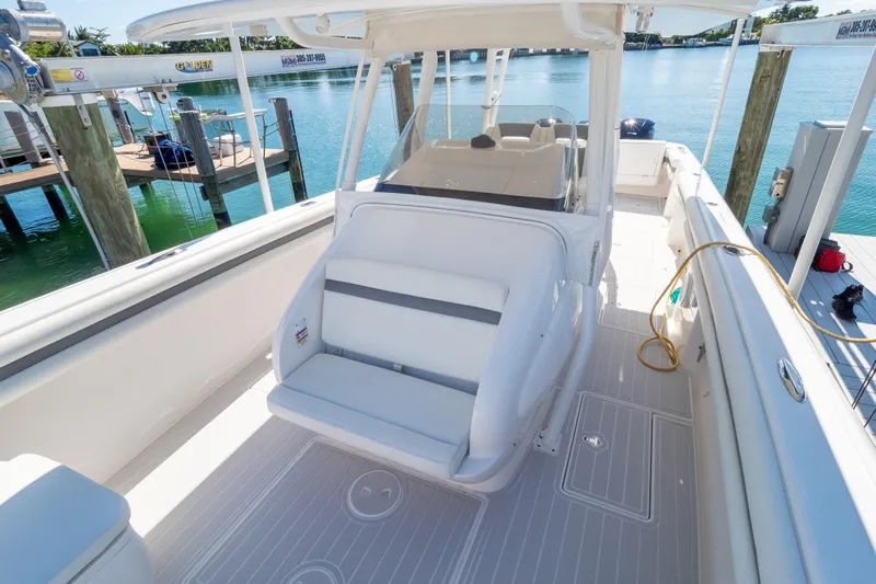  Yacht Photos Pics 2015 Intrepid 400 Center Console boat docked, featuring spacious seating and sleek design.