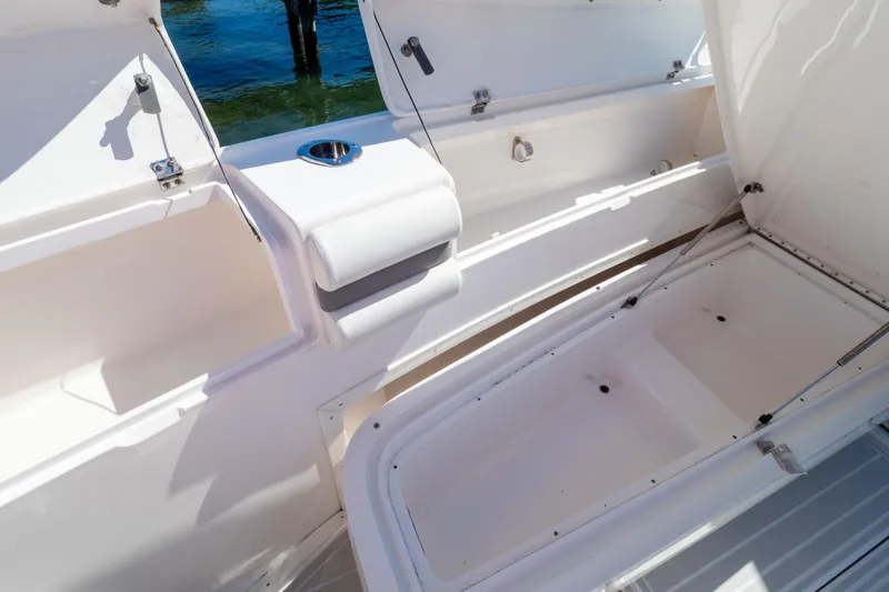  Yacht Photos Pics 2015 Intrepid 400 Center Console boat storage compartments open on deck.