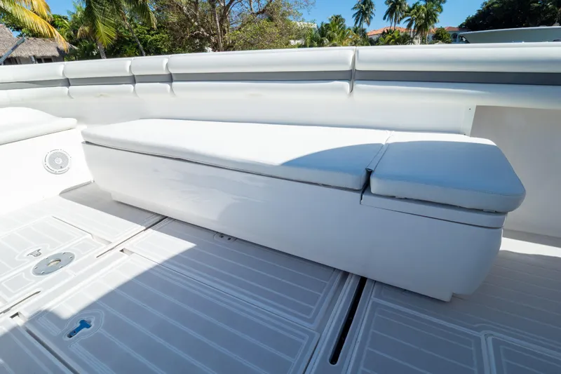  Yacht Photos Pics 2015 Intrepid 400 Center Console boat seating area with white cushioned bench.