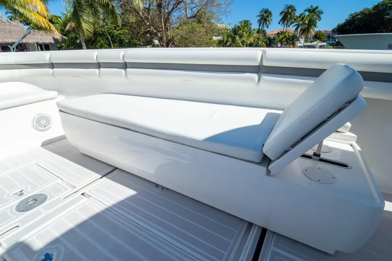  Yacht Photos Pics 2015 Intrepid 400 Center Console boat with white cushioned seating and tropical background.