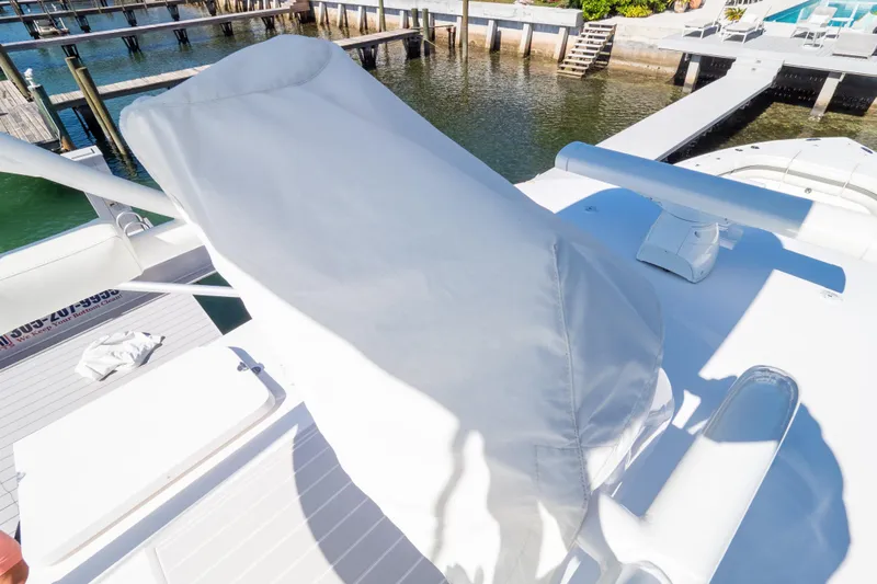  Yacht Photos Pics 2015 Intrepid 400 Center Console boat with covered seating, docked by a waterfront.