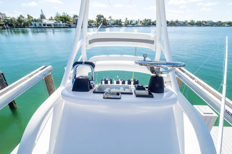  Yacht Photos Pics 2015 Intrepid 400 Center Console boat helm with scenic waterfront view.
