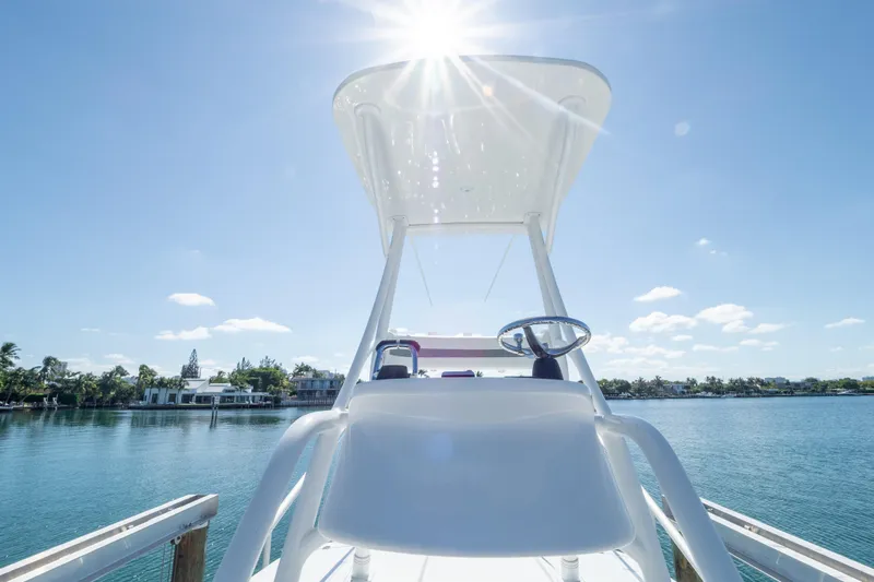  Yacht Photos Pics 2015 Intrepid 400 Center Console boat under bright sun on calm water.