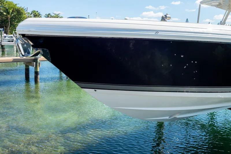  Yacht Photos Pics 2015 Intrepid 400 Center Console boat docked in clear water.