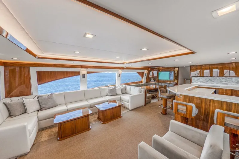 Marlin Magic Yacht Photos Pics Luxurious interior of 2021 Viking 92 Skybridge yacht with elegant seating and modern design.