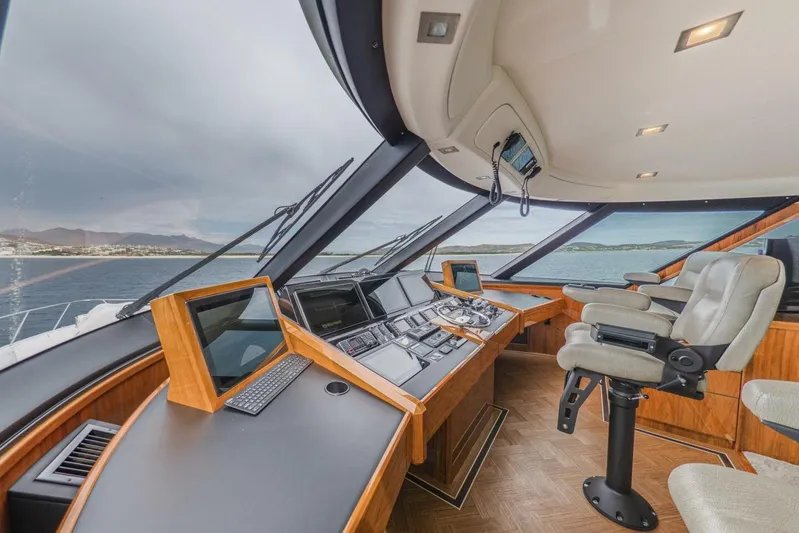 Marlin Magic Yacht Photos Pics Luxurious 2021 Viking 92 Skybridge yacht interior with advanced navigation controls and panoramic views.