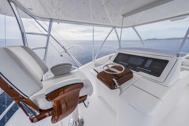 Marlin Magic Yacht Photos Pics Luxurious 2021 Viking 92 Skybridge yacht helm with ocean view and modern controls.