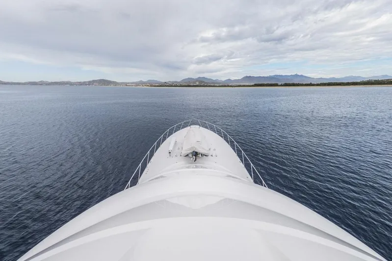 Marlin Magic Yacht Photos Pics Bow view of 2021 Viking 92 Skybridge yacht on open water.