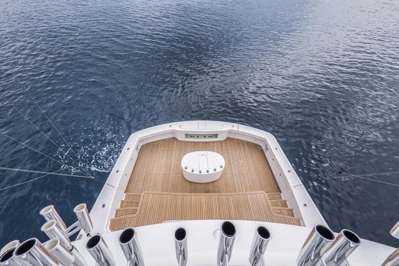 Marlin Magic Yacht Photos Pics Aerial view of 2021 Viking 92 Skybridge yacht deck on calm water.