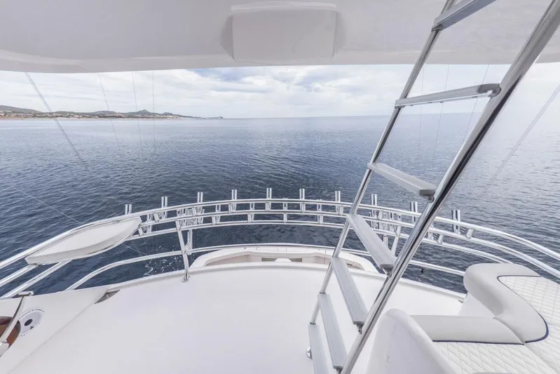 Marlin Magic Yacht Photos Pics 2021 Viking 92 Skybridge yacht with ocean view and sleek design.