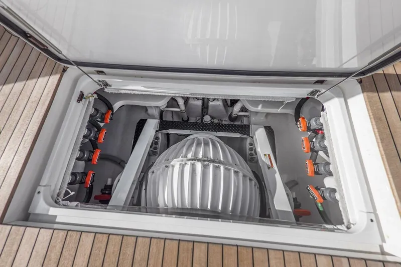 Marlin Magic Yacht Photos Pics Engine compartment of 2021 Viking 92 Skybridge yacht, showcasing mechanical components.