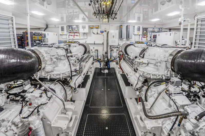 Marlin Magic Yacht Photos Pics Engine room of 2021 Viking 92 Skybridge yacht, showcasing dual engines and advanced machinery.