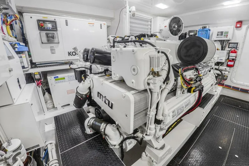Marlin Magic Yacht Photos Pics Engine room of 2021 Viking 92 Skybridge yacht with MTU machinery and control systems.