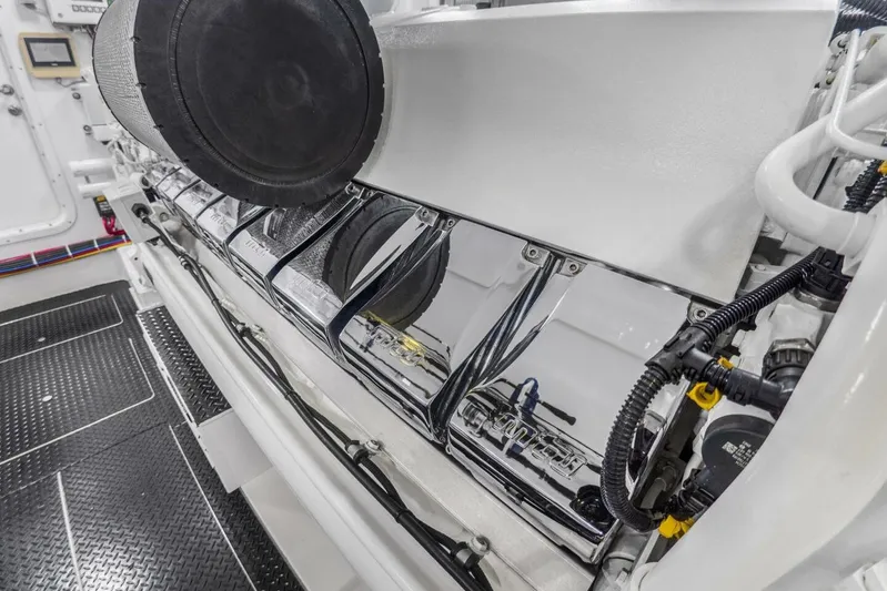 Marlin Magic Yacht Photos Pics Engine room of 2021 Viking 92 Skybridge yacht, showcasing sleek machinery and components.