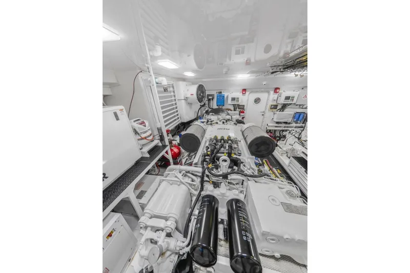 Marlin Magic Yacht Photos Pics Engine room of 2021 Viking 92 Skybridge yacht, showcasing advanced machinery and equipment.