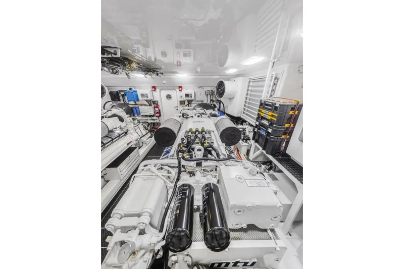 Marlin Magic Yacht Photos Pics Engine room of 2021 Viking 92 Skybridge yacht, featuring advanced MTU machinery.