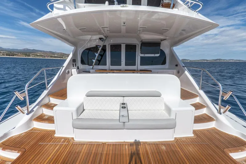 Marlin Magic Yacht Photos Pics Luxurious 2021 Viking 92 Skybridge yacht with elegant seating and ocean view.