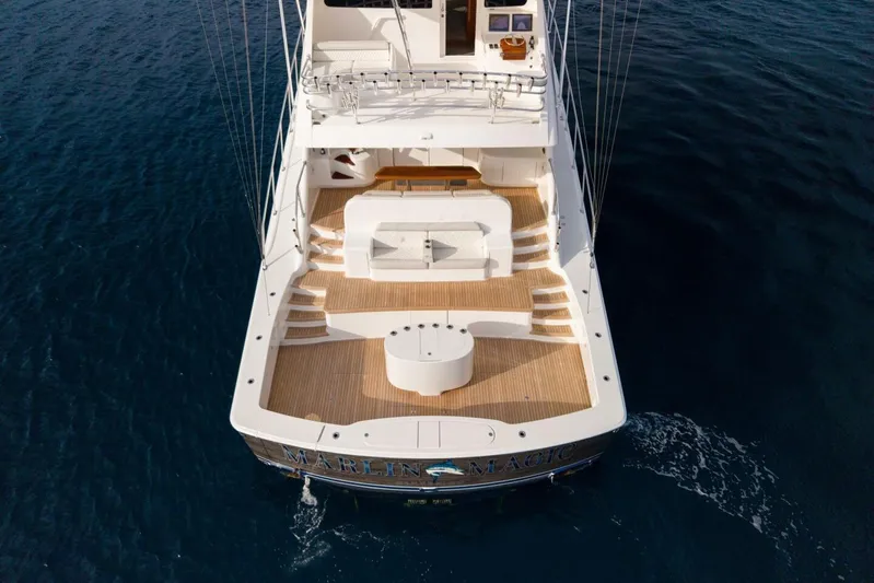 Marlin Magic Yacht Photos Pics Aerial view of 2021 Viking 92 Skybridge yacht on open water.