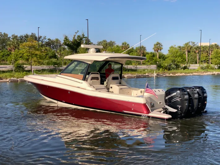  Yacht Photos Pics 2023 Chris-Craft Calypso 35 boat with triple Mercury engines on a sunny day.