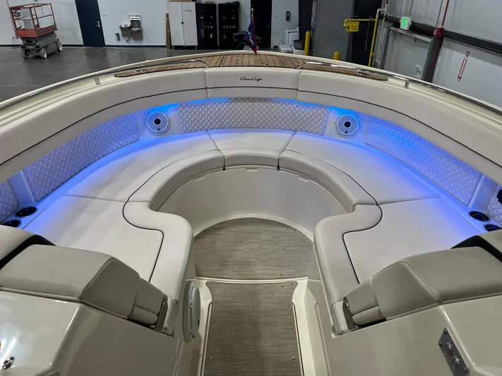  Yacht Photos Pics 2023 Chris-Craft Calypso 35 boat interior with elegant seating and blue LED lighting.