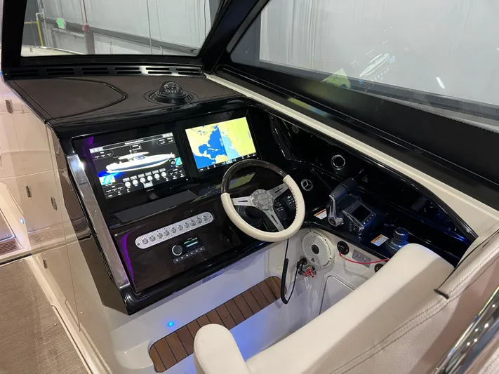  Yacht Photos Pics 2023 Chris-Craft Calypso 35 helm with advanced navigation and control systems.