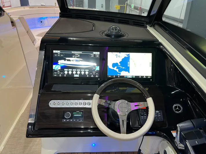  Yacht Photos Pics 2023 Chris-Craft Calypso 35 helm with dual screens and modern controls.