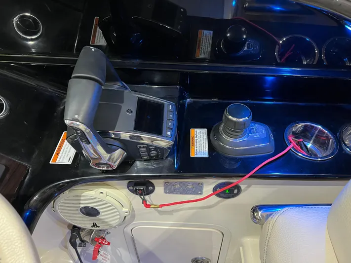  Yacht Photos Pics Control panel of 2023 Chris-Craft Calypso 35 boat with throttle and joystick.