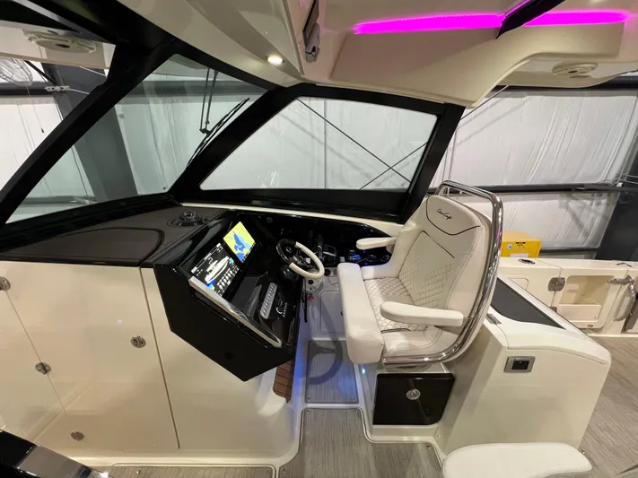  Yacht Photos Pics 2023 Chris-Craft Calypso 35 helm with luxurious seating and advanced navigation system.
