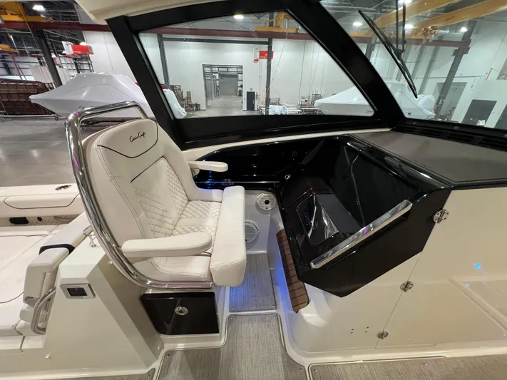  Yacht Photos Pics 2023 Chris-Craft Calypso 35 helm with luxurious seating and modern dashboard.