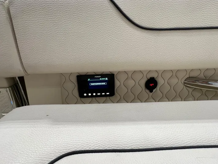  Yacht Photos Pics 2023 Chris-Craft Calypso 35 interior with Fusion audio system and elegant upholstery.