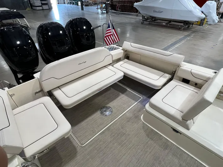  Yacht Photos Pics 2023 Chris-Craft Calypso 35 boat interior with seating and American flag.