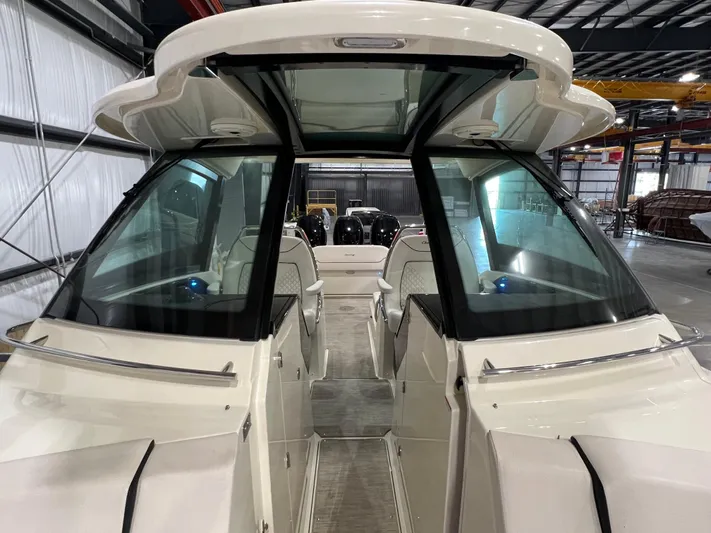  Yacht Photos Pics 2023 Chris-Craft Calypso 35 boat interior with glass roof and seating.