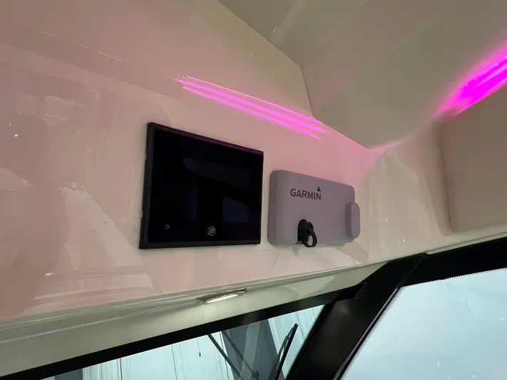  Yacht Photos Pics 2023 Chris-Craft Calypso 35 interior with Garmin navigation system and digital display.