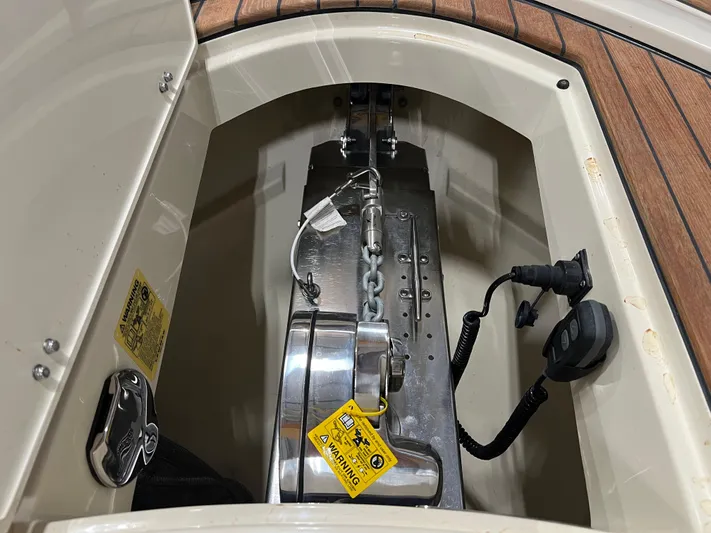 Yacht Photos Pics Anchor compartment of 2023 Chris-Craft Calypso 35 with chain and control panel.