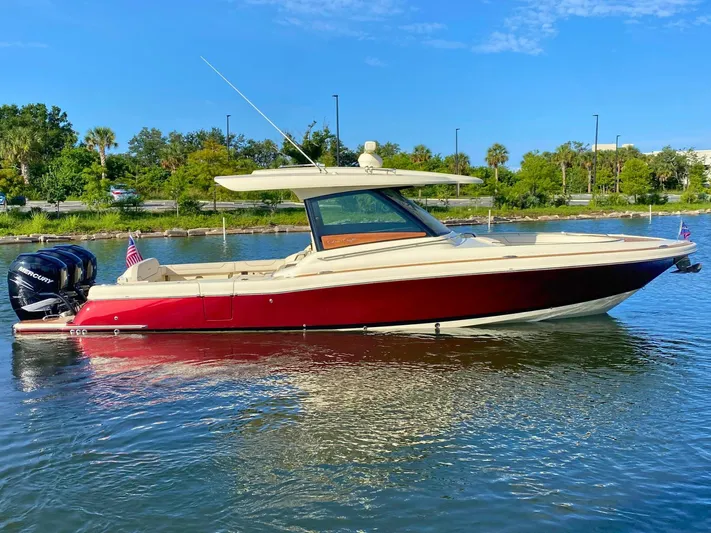  Yacht Photos Pics 2023 Chris-Craft Calypso 35 boat on water, featuring sleek design and powerful engines.